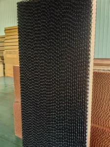 High-efficiency evaporative cooling pads installed in a poultry house for optimal temperature control and animal welfare.